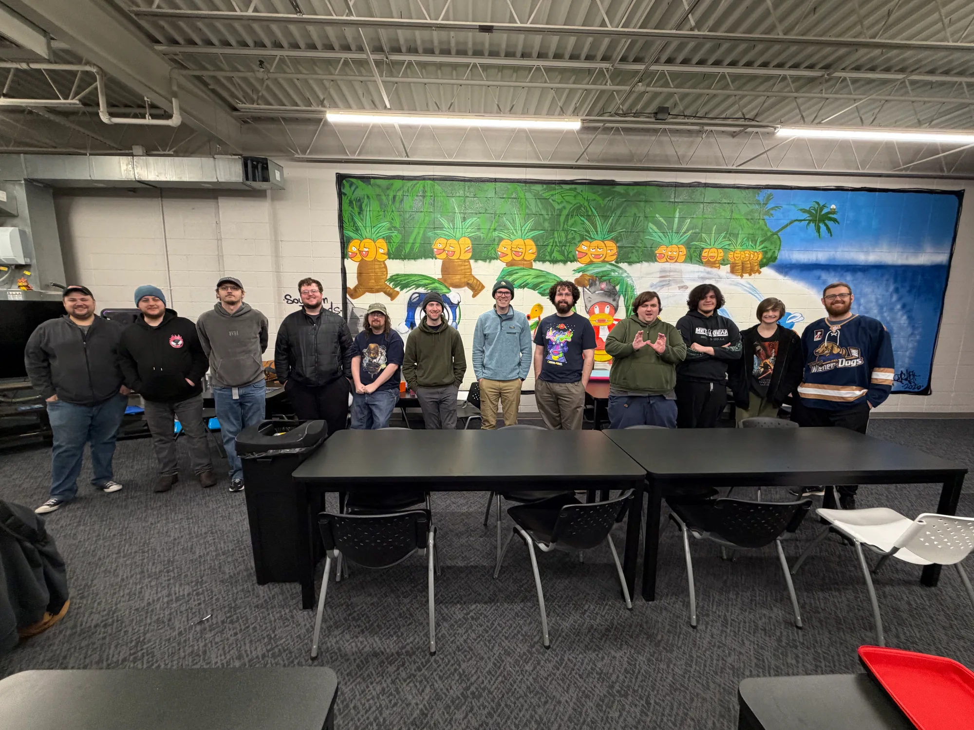 A group of Izzi's Gym community members gather together inside the store